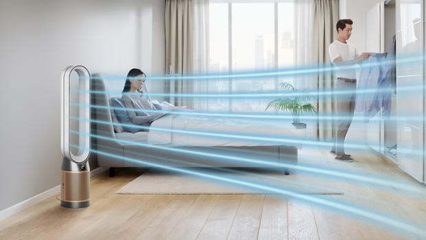 Woman in bed beside Dyson Purifier fan