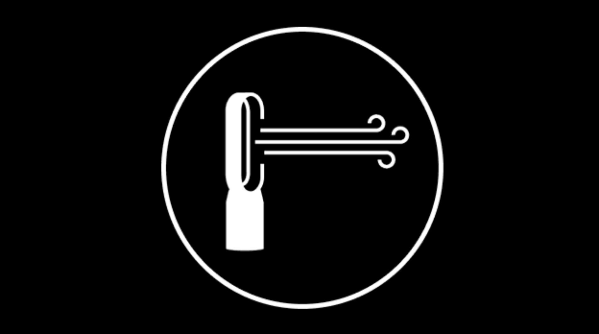 A man and woman setting the table in an open plan kitchen and dining area