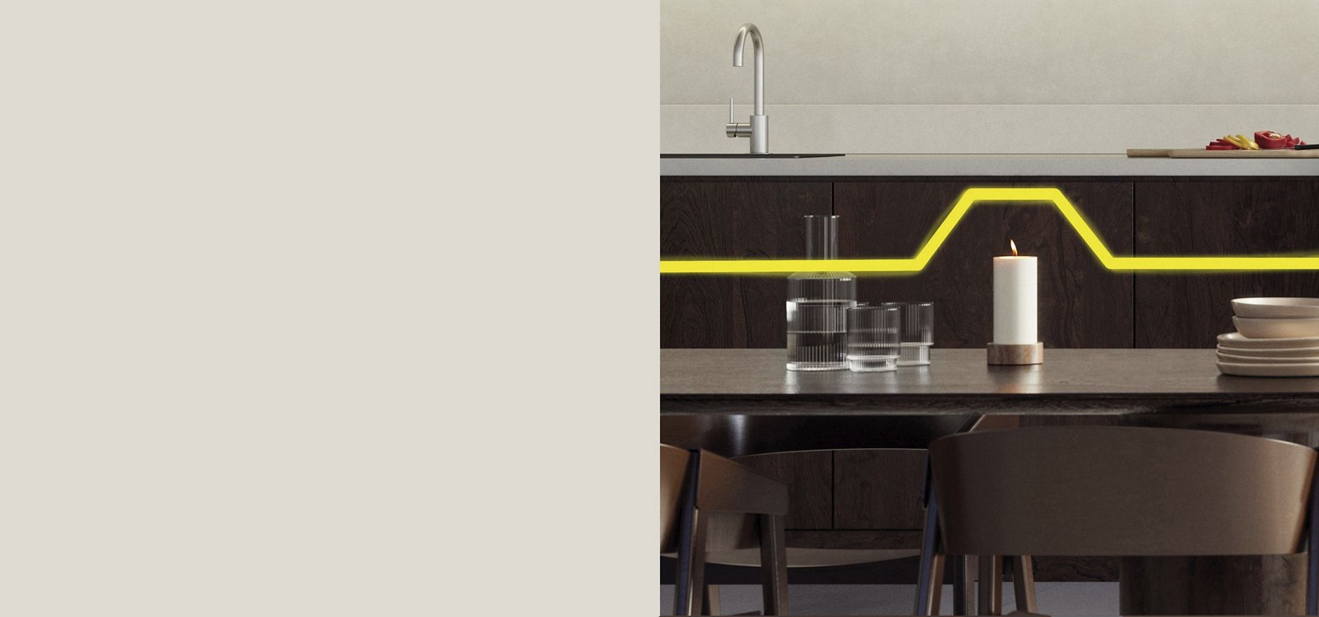 A burning candle sat on a kitchen table.