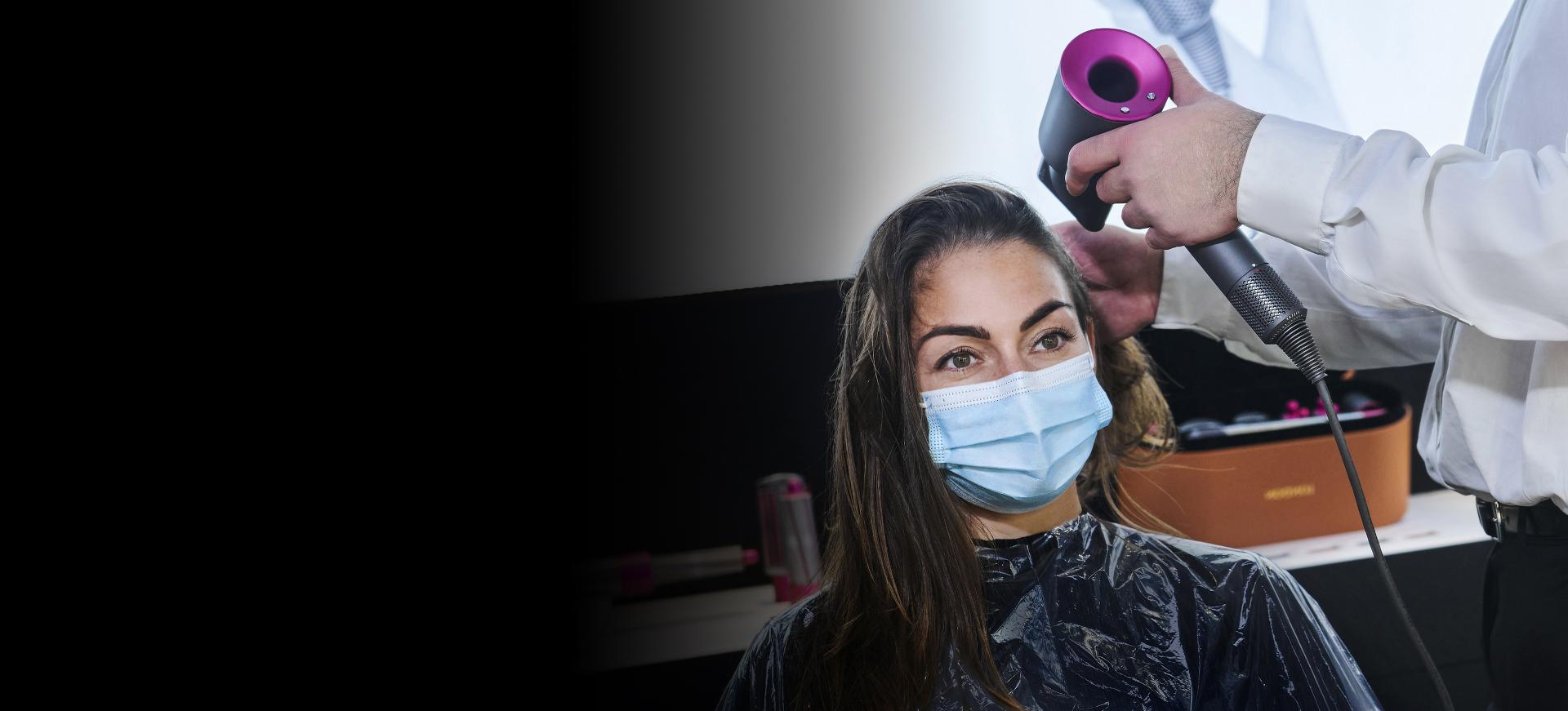 Woman having her hair styled with the Dyson Supersonic hair dryer