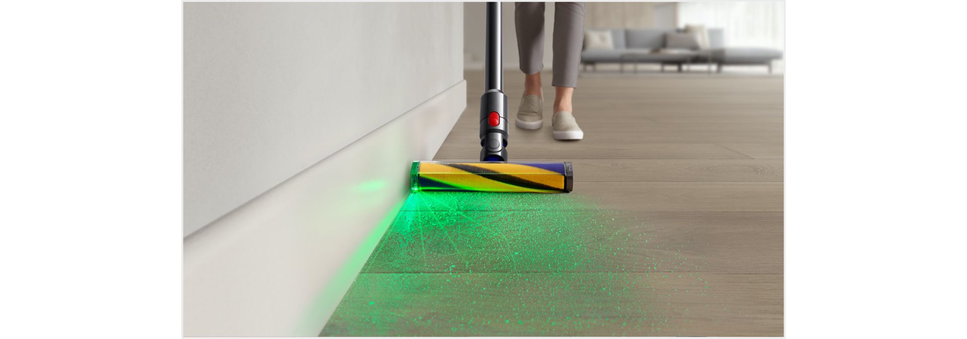 Dyson vacuum with Illuminated cleaner head being used to clean a hard floor.
