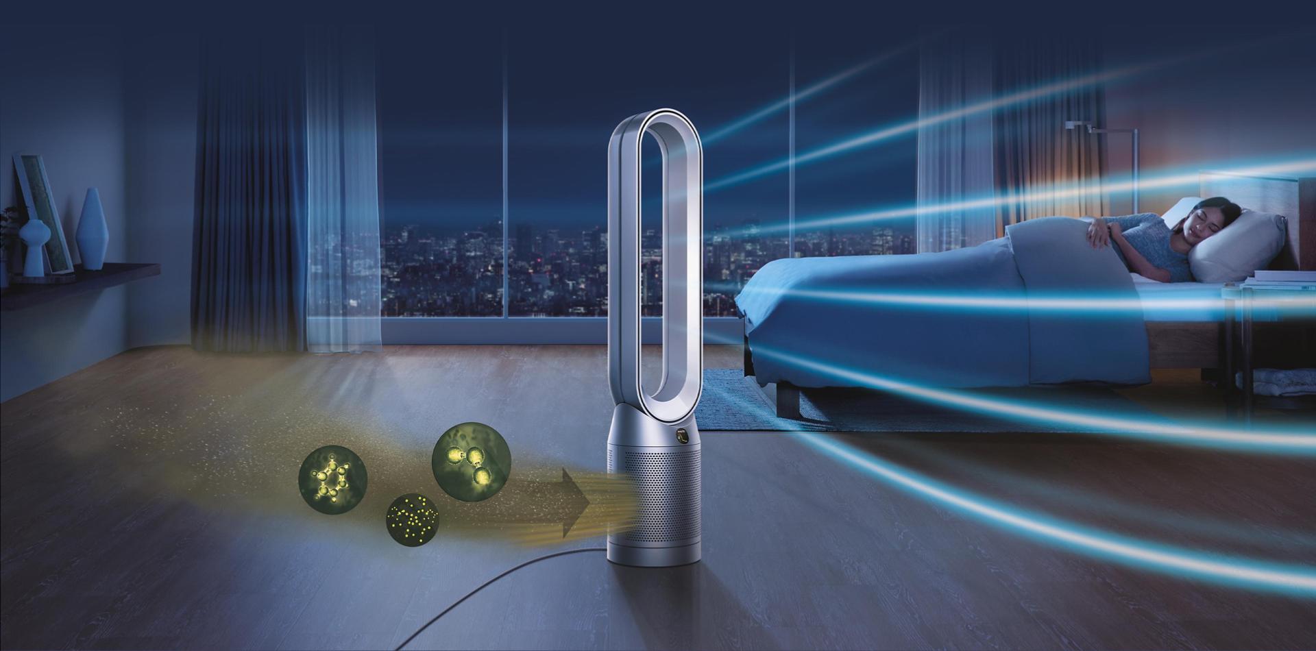 A Dyson air purifier in a bedroom at night time