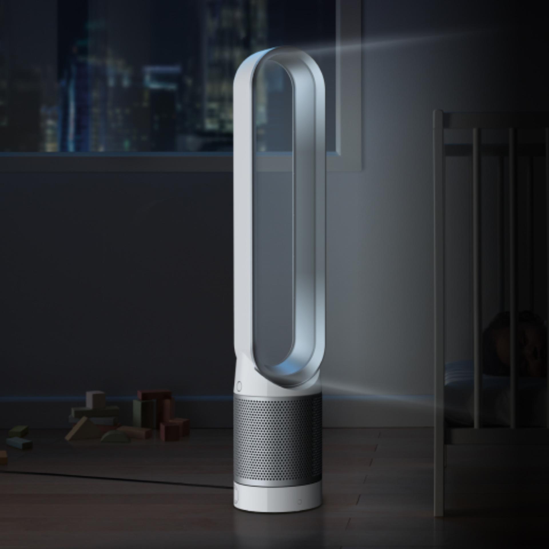 Side view of the Dyson Cool tower fan in a bedroom at night.