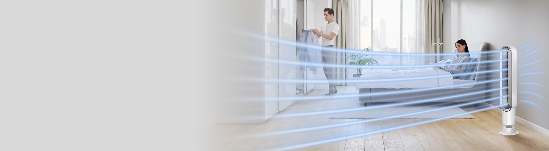 A Dyson Cool tower fan creates powerful airflow in a large bedroom.