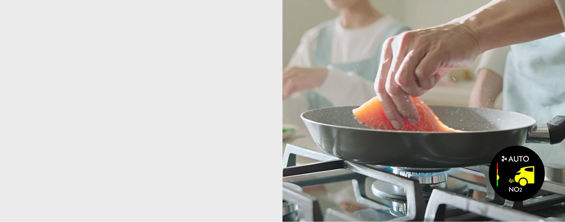 A model frying salmon.