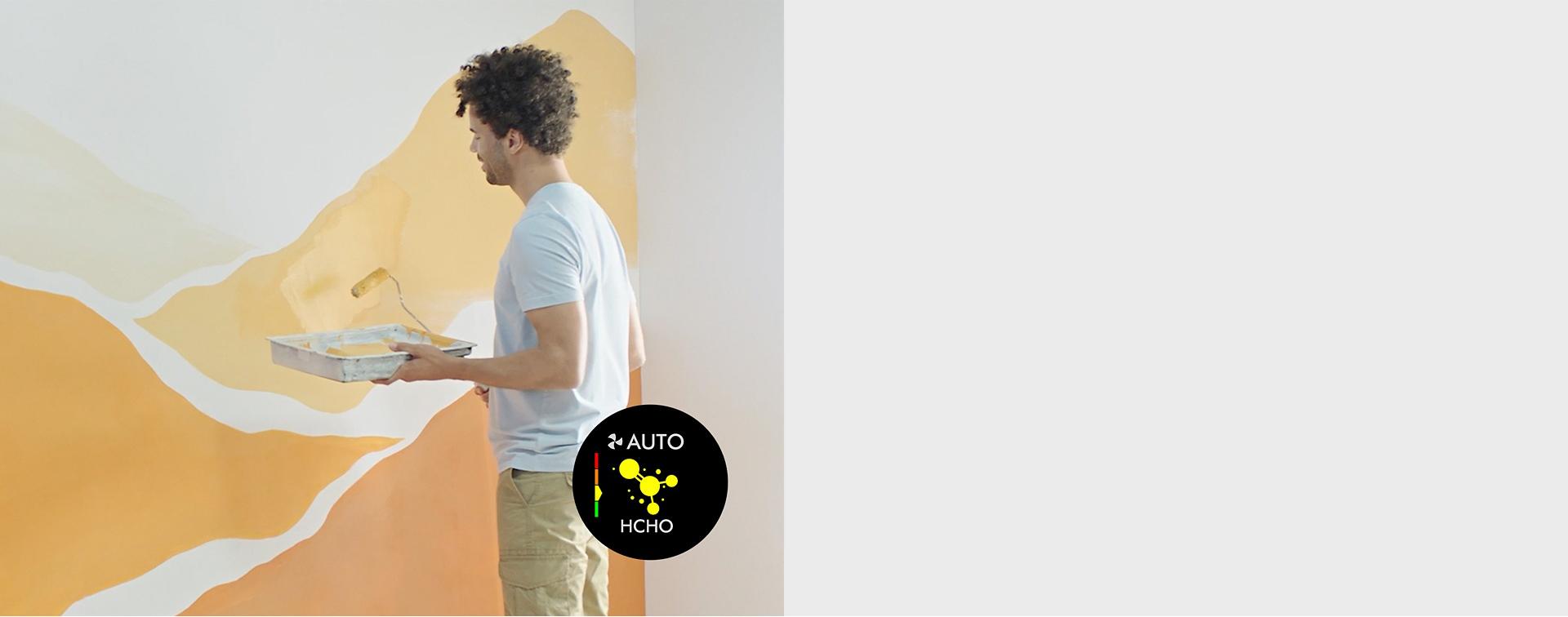 عارِضة تقوم بطلاء منزلها باللون البرتقالي والأصفر.