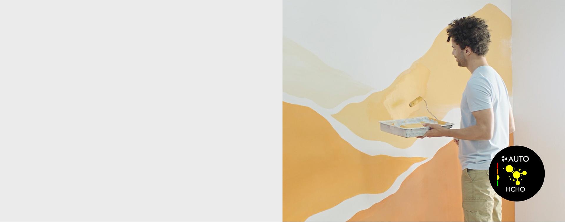 A model painting their home orange and yellow.