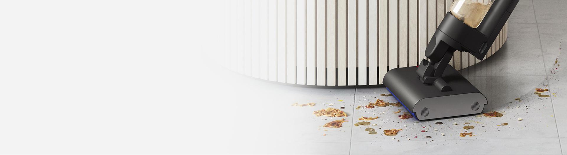 Closer view of the Dyson Wash G1 wet floor cleaner manoeuvring around a circular obstacle.