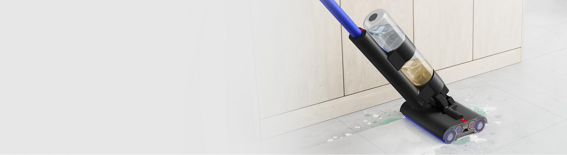 Dyson Wash G1 cleaning a bathroom floor.