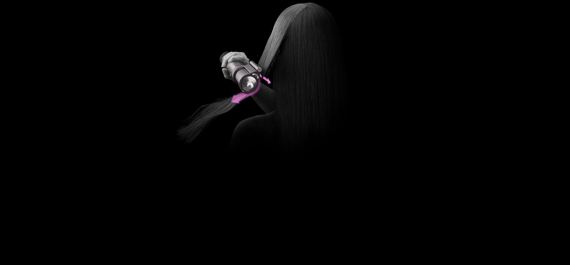A close up of the back of a woman's head as she dries her hair with the Dyson Airwrap multi-styler and dryer