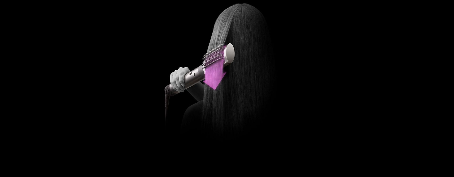 Dyson Airwrap styling hair with brush attachment.