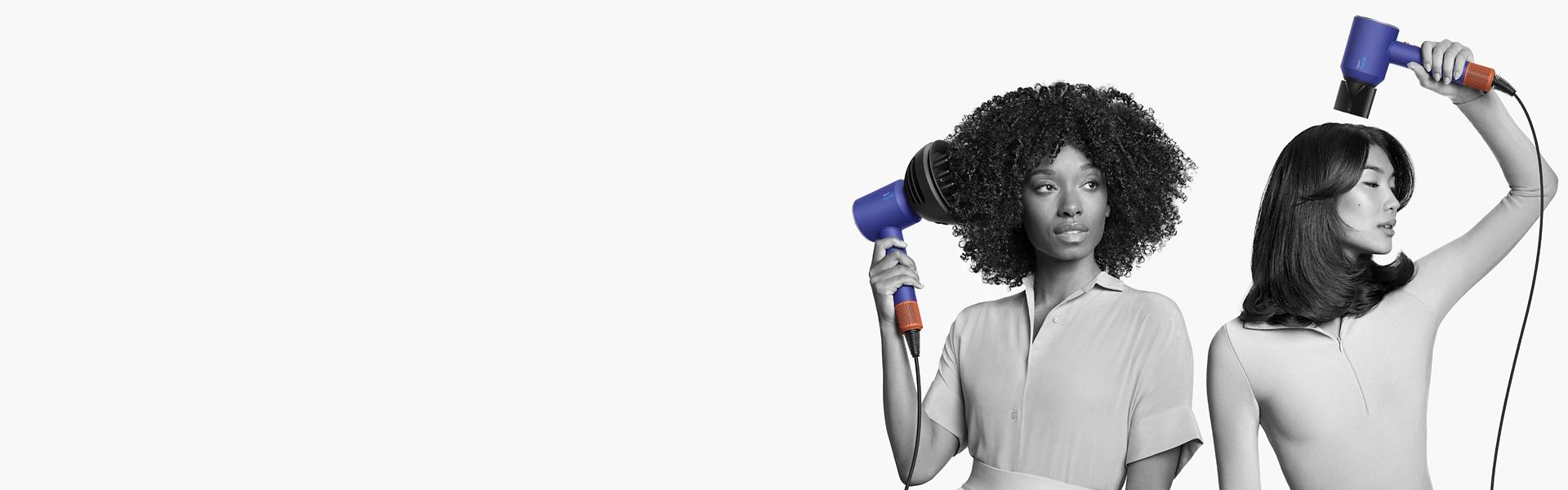 A woman with coily, voluminous hair and a man with short blunt hair