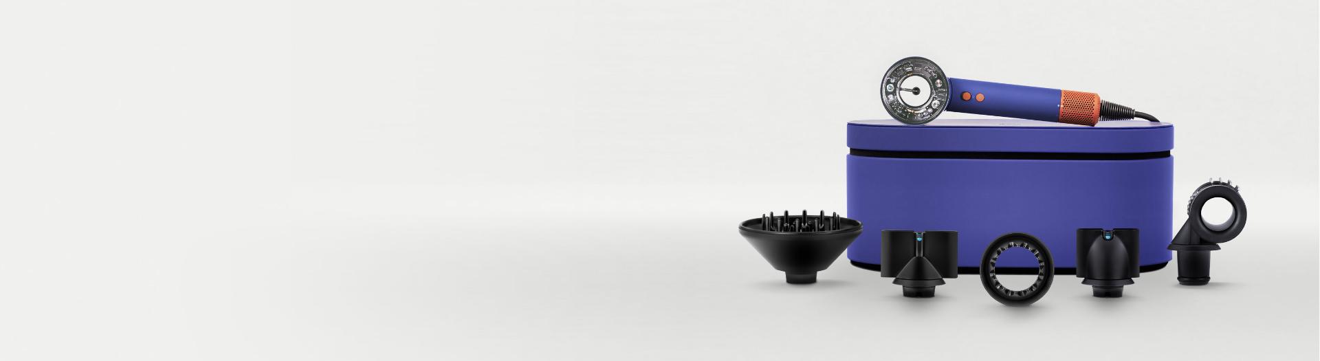 Dyson Supersonic hair dryer with accessories.