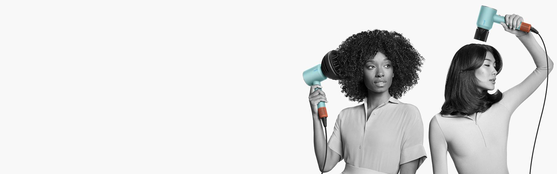 A woman with coily, voluminous hair and a man with short blunt hair