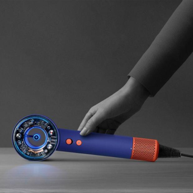 The Dyson Supersonic Nural hair dryer is rested on a table, activating the Pause detect mode.