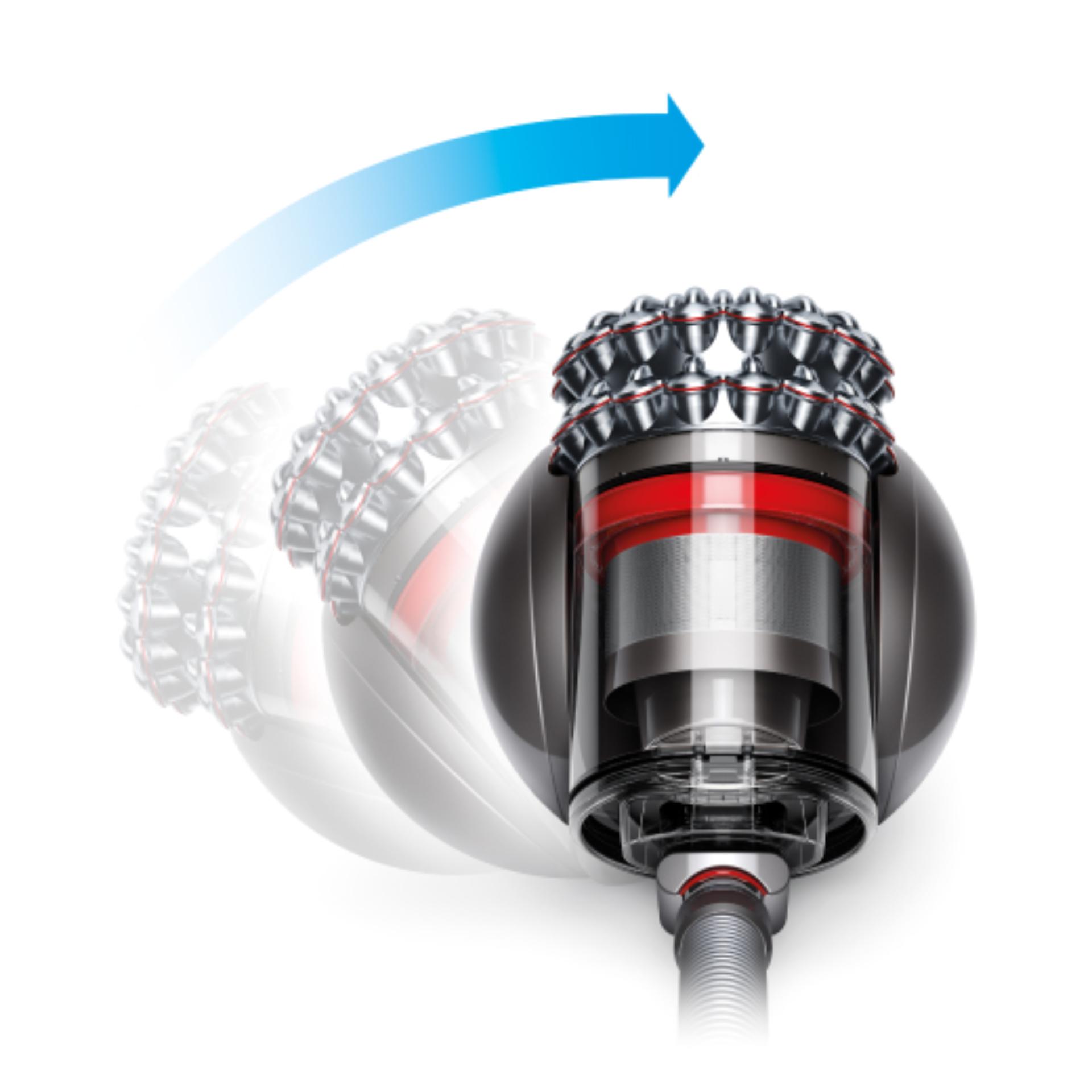 Un aspirator cilindric Dyson care se redresează după ce a fost răsturnat.