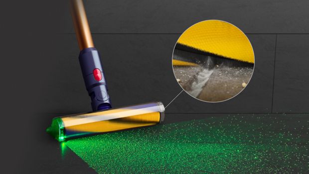 Low angle close-up of the Fluffy Optic cleaner head illuminating dust.