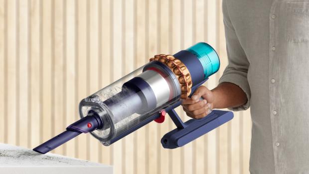 The Dyson Gen5outsize vacuum in handheld mode cleaning a shelf.