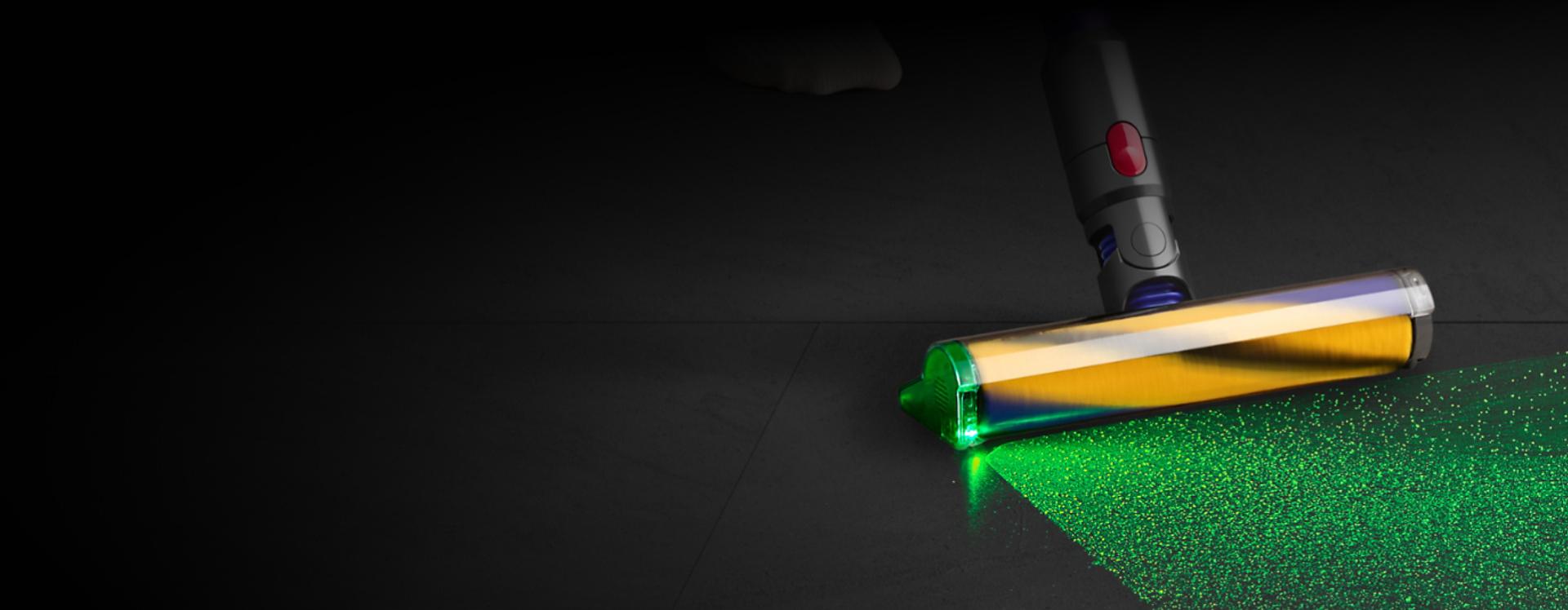 Low angle close-up of the Fluffy Optic cleaner head illuminating dust.