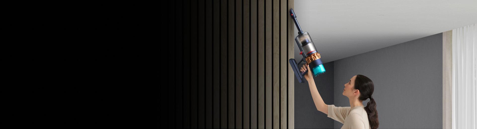 A ceiling being cleaned with the Dyson Gen5detect vacuum in handheld mode.