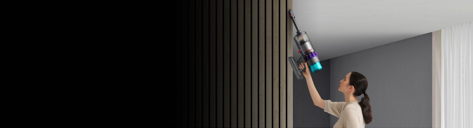 A ceiling being cleaned with the Dyson Gen5detect vacuum in handheld mode.