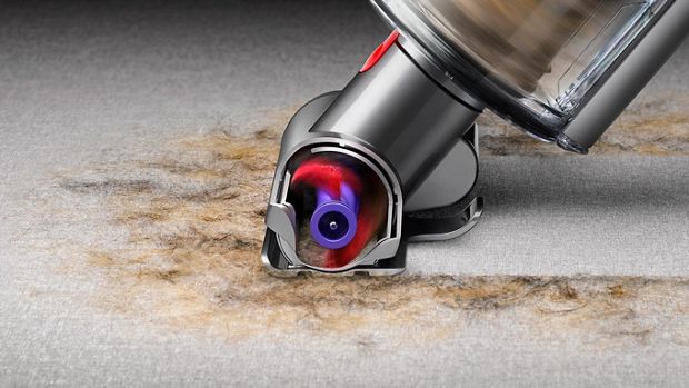 Mini-motorised tool picking up debris.