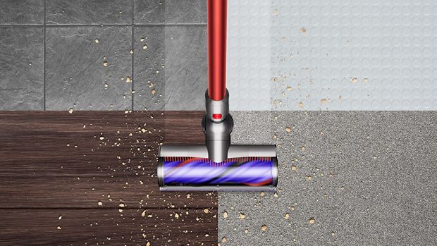 The  Dyson V11 Total Clean being used across four different floor types.