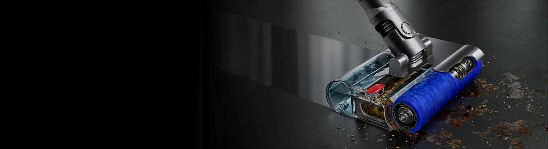 The Dyson V12s Detect Slim Submarine cleans a spill off of a hard floor.