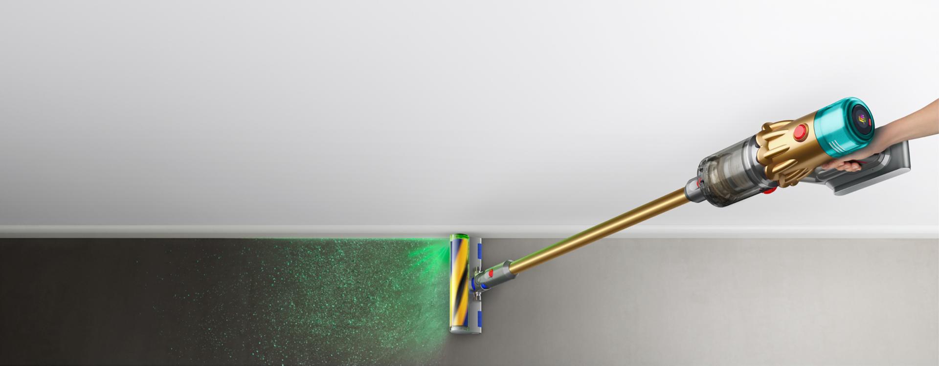 The Dyson V12s Detect Slim Submarine wet and dry vacuum cleaner illuminates and cleans dust from a hard floor.