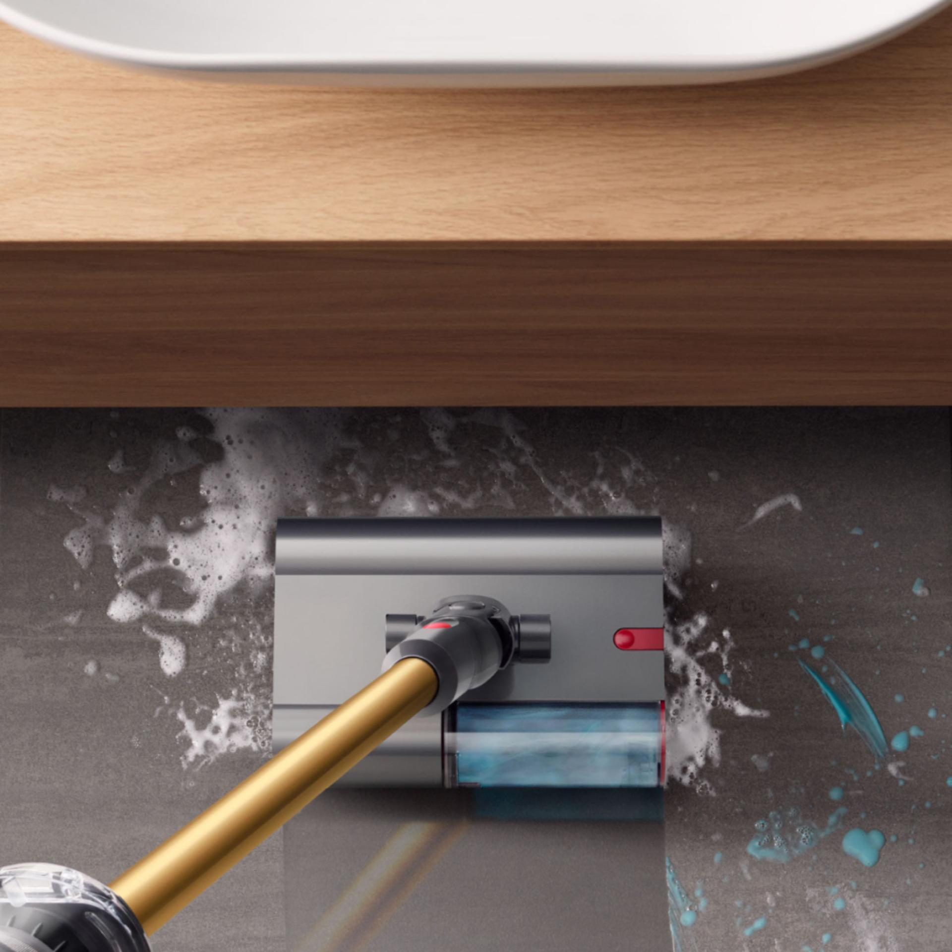 The Dyson V12s Detect Slim Submarine cleans the floor of a bathroom.