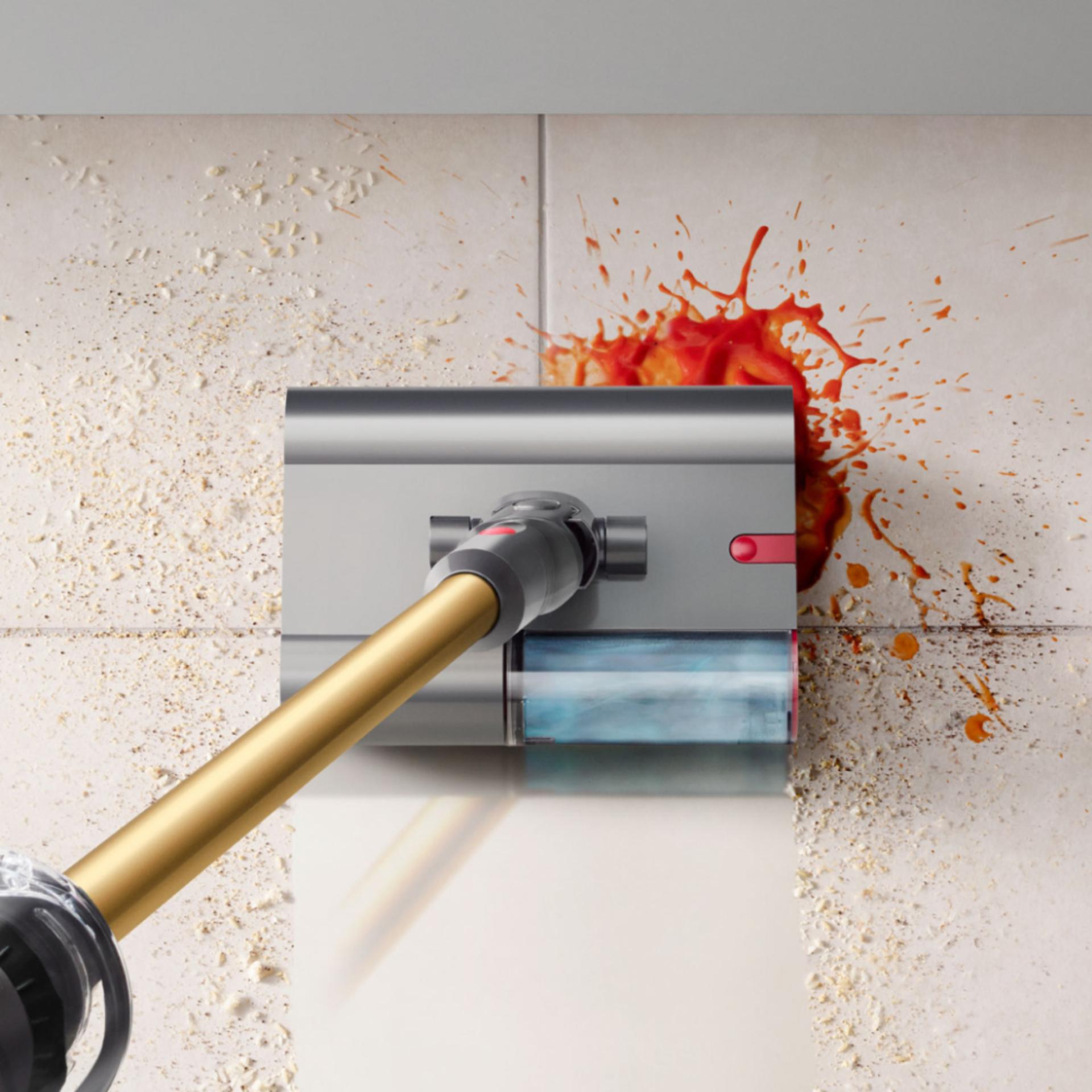 The Dyson V12s Detect Slim Submarine cleans the floor of a kitchen.