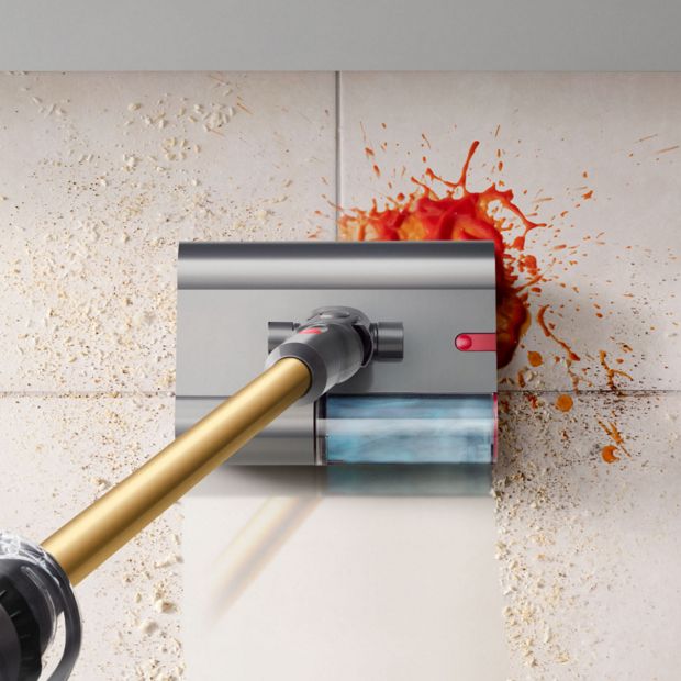 The Dyson V12s Detect Slim Submarine cleans the floor of a kitchen.