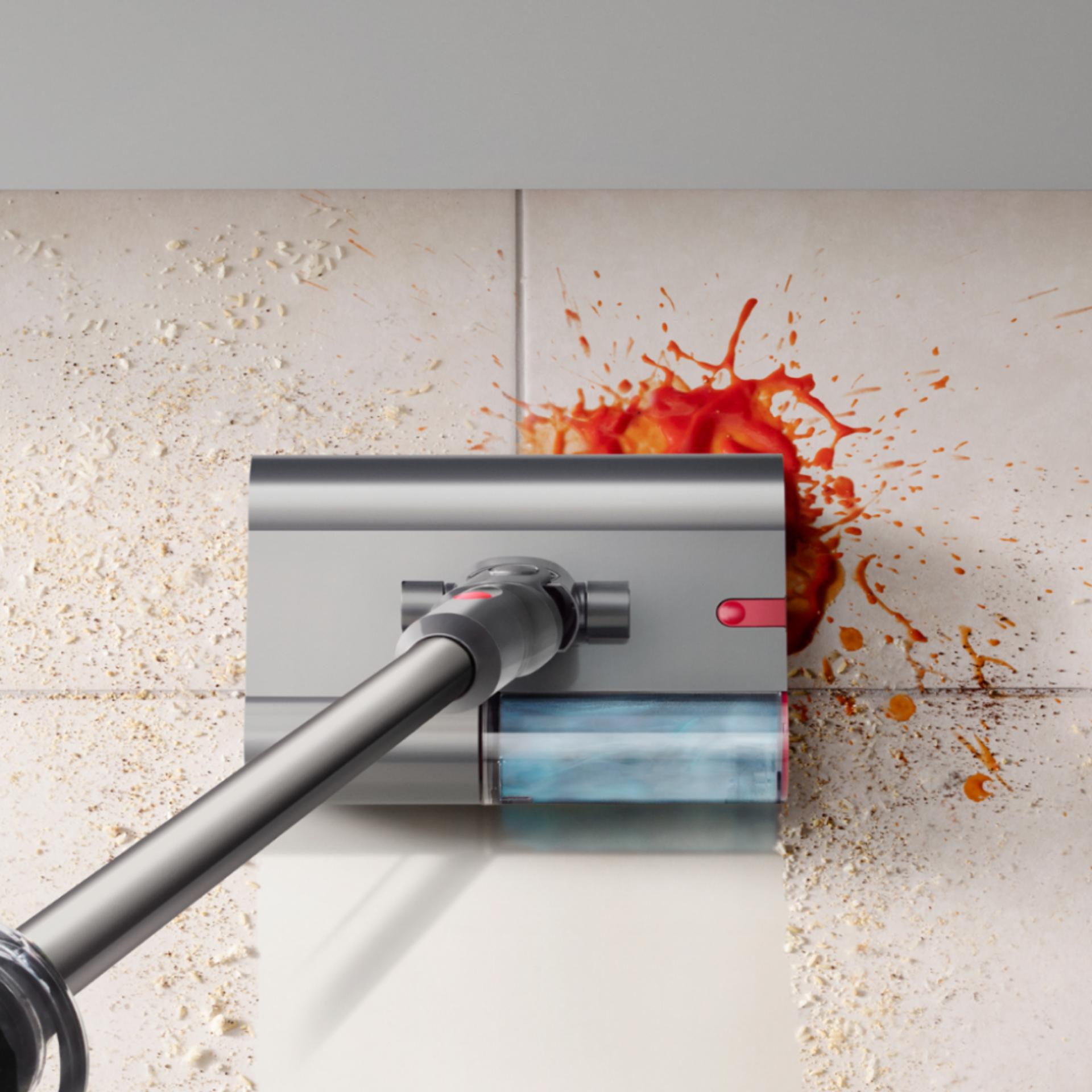 The Dyson V12s Detect Slim Submarine cleans the floor of a kitchen.