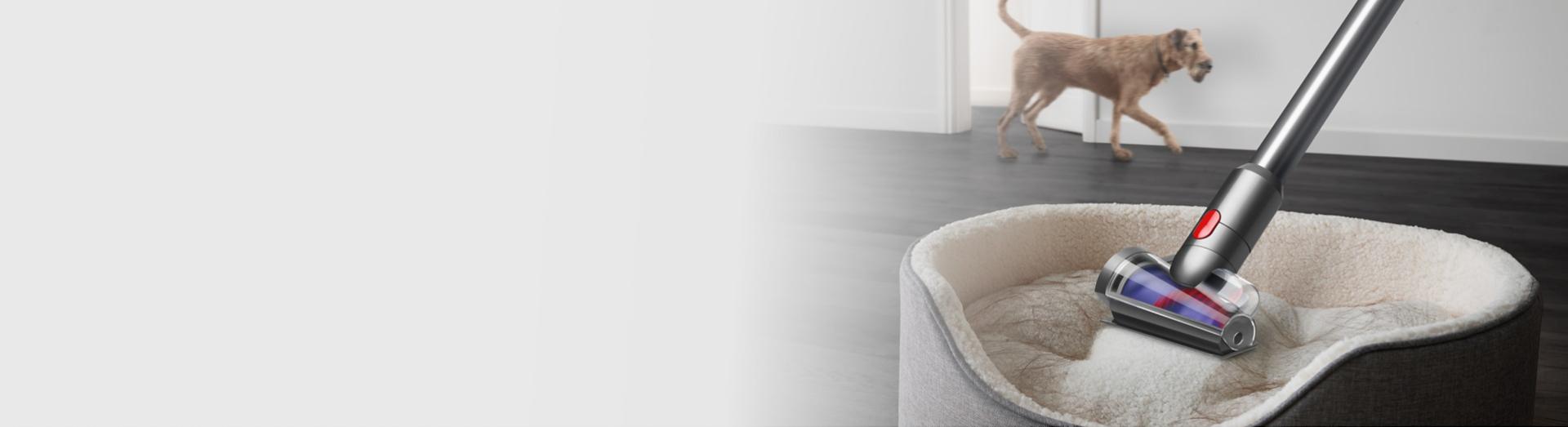 Dyson Hair screw tool removing hair from fabric.