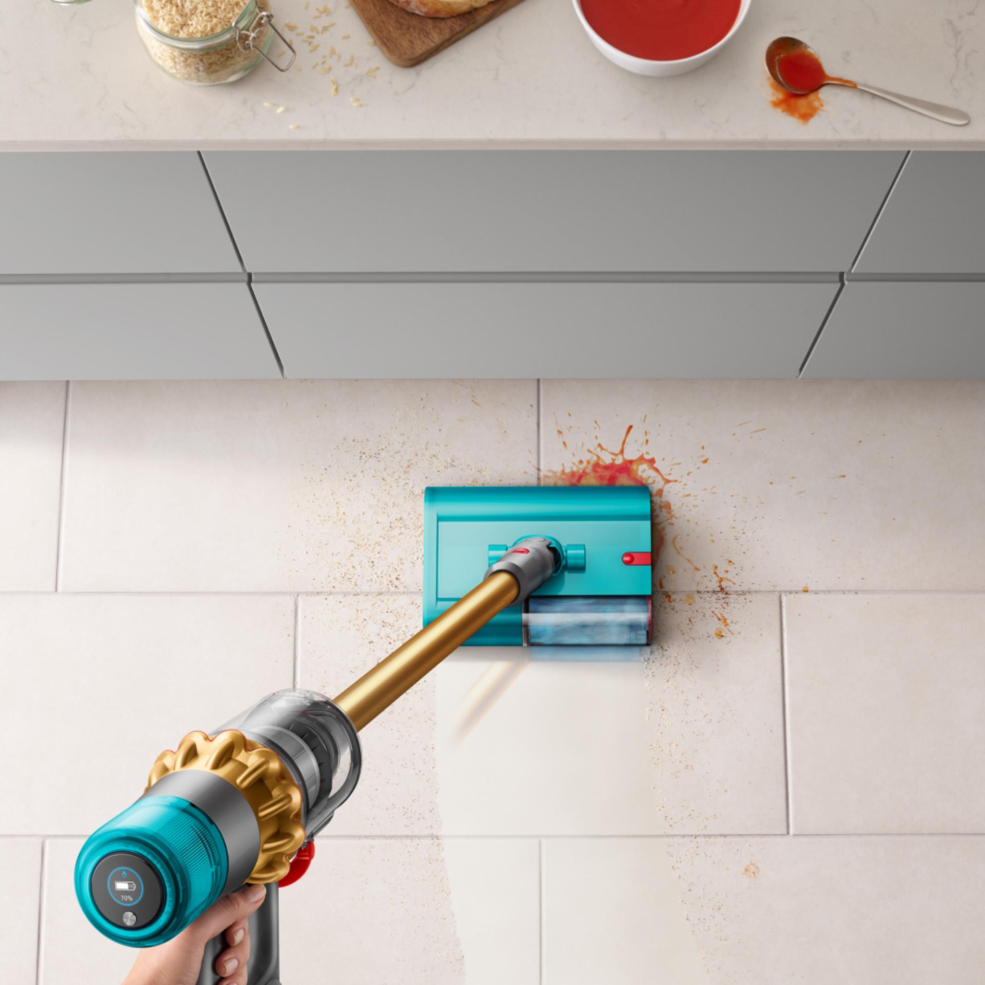 The Dyson V15s Detect Submarine cleans the floor of a kitchen.