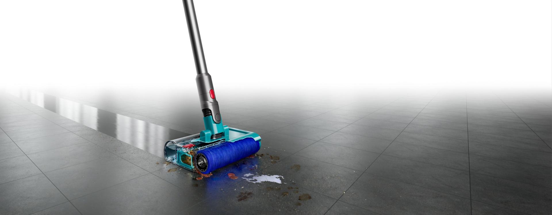 The Dyson V15s Detect Submarine wet and dry vacuum cleaner deep cleans a tile floor.