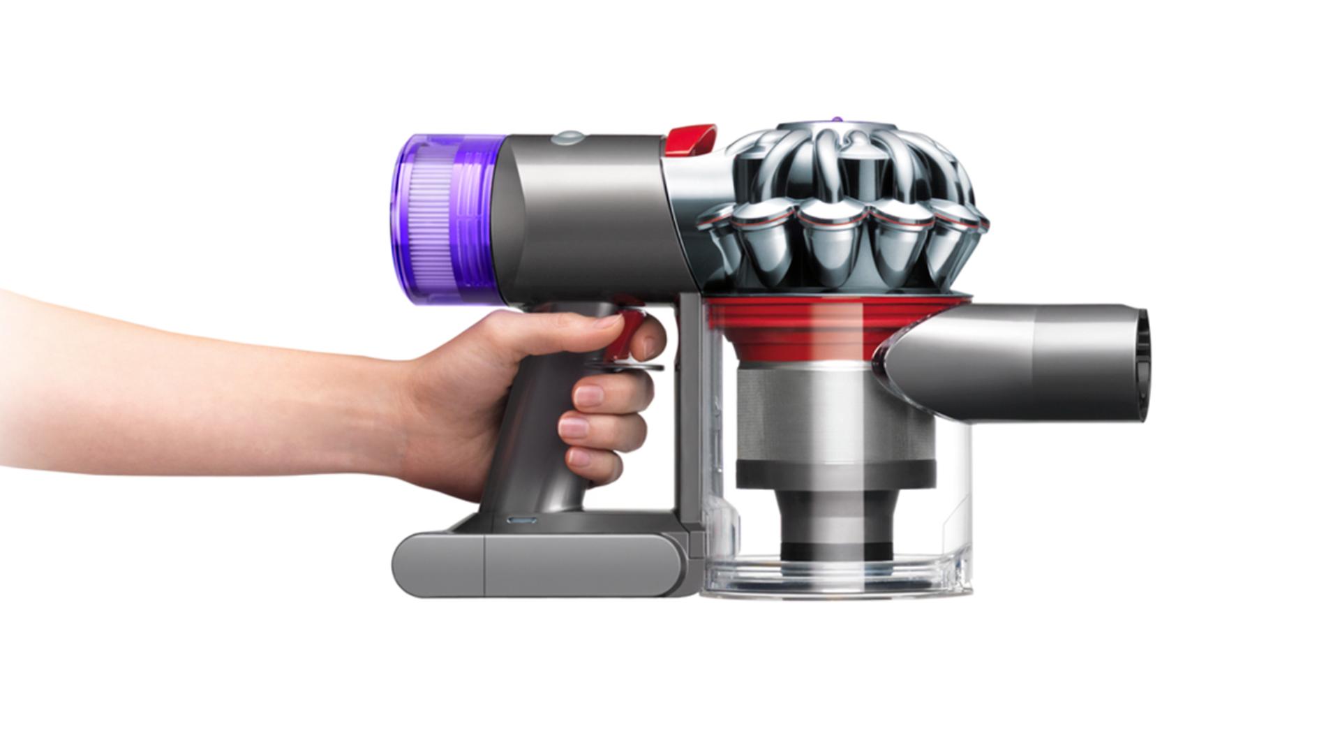 Side view of the body of the Dyson V8 vacuum cleaning up high and down low.