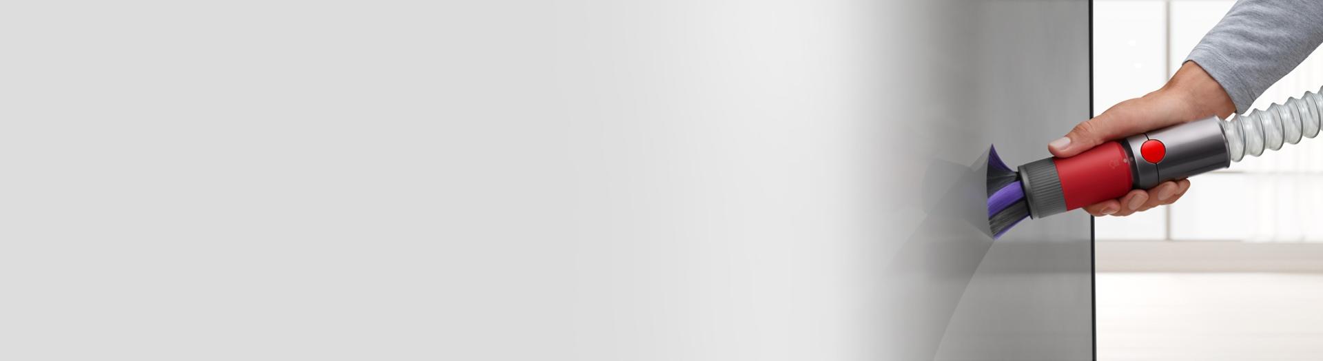 Scratch-free dusting brush dusting a TV.