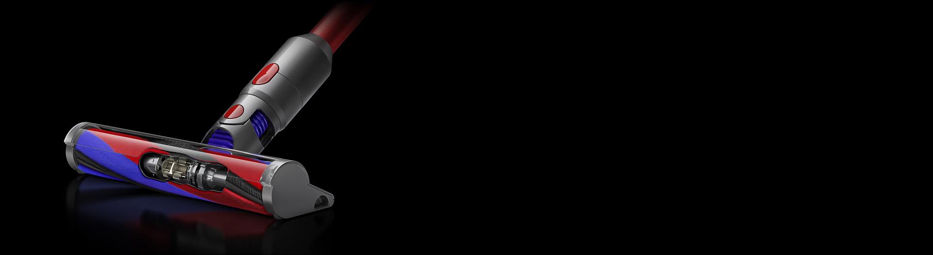 Close-up cutaway showing the brush bar and motor in the Slim Fluffy cleaner head.