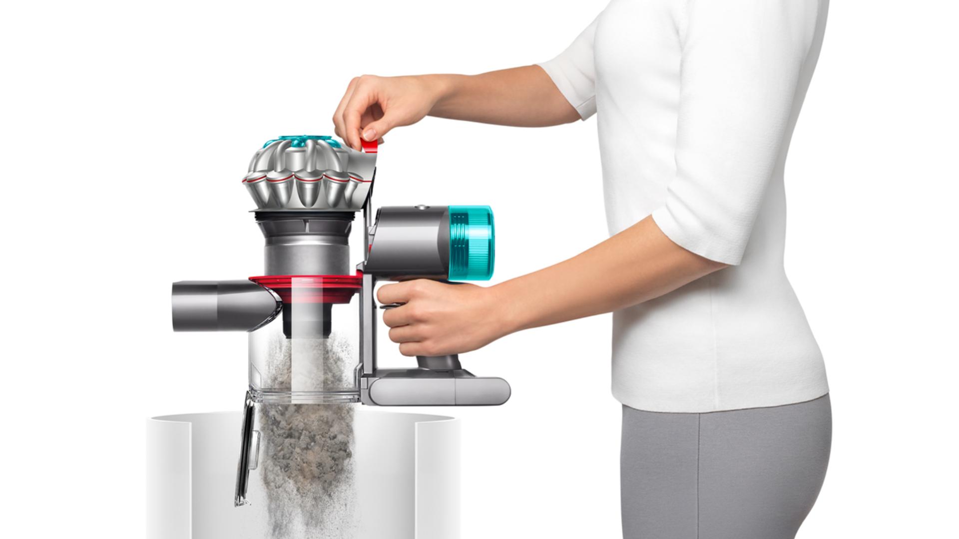 The Dyson V8 vacuum being emptied in a bin.