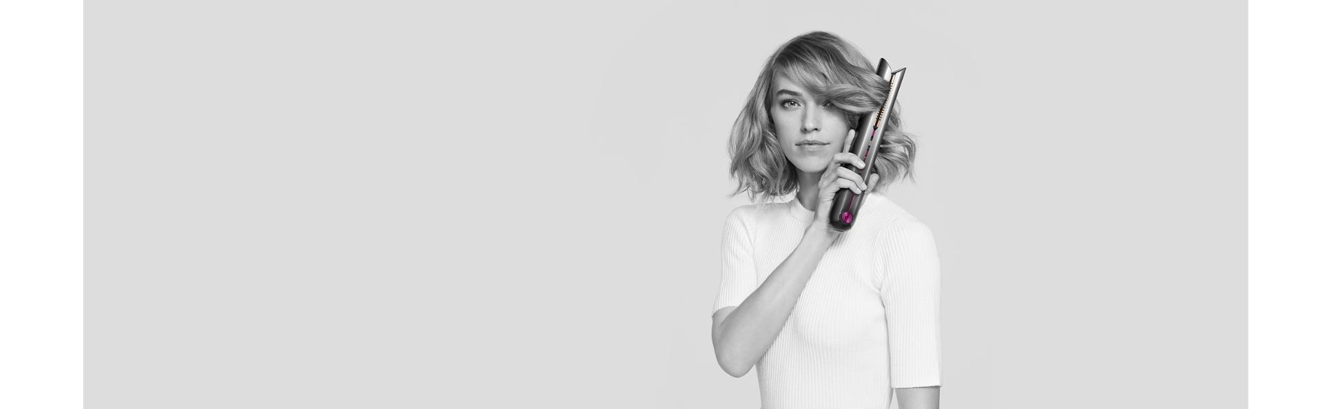 Model using Dyson Corrale straightener