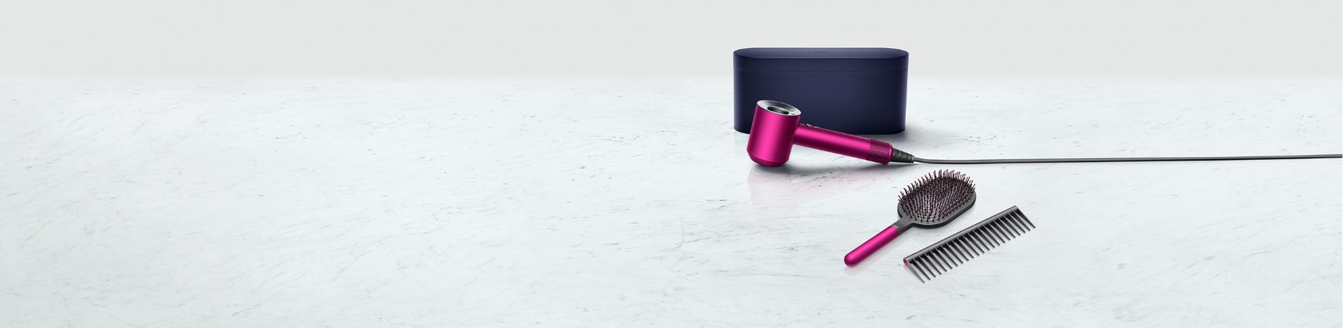 Dyson Supersonic™ hair dryer with presentation case, paddle brush, and detangling comb