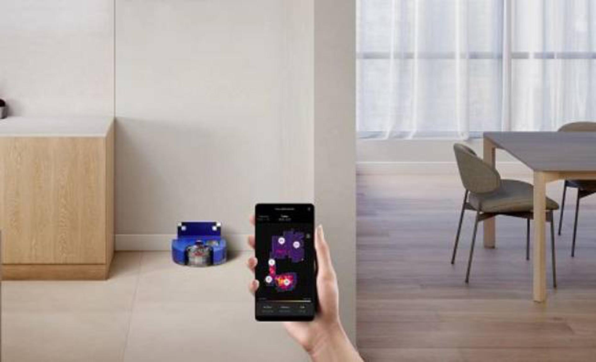 Dyson 360 Vis Nav next to a mobile phone screen with app