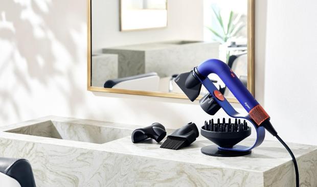 the Dyson Supersonic r™ Professional hair dryer on a bench