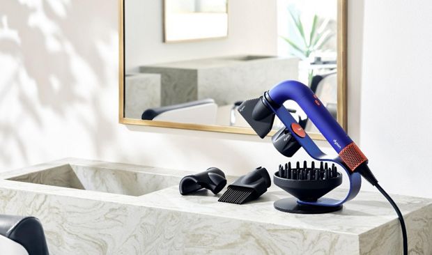 the Dyson Supersonic r™ Professional hair dryer on a bench