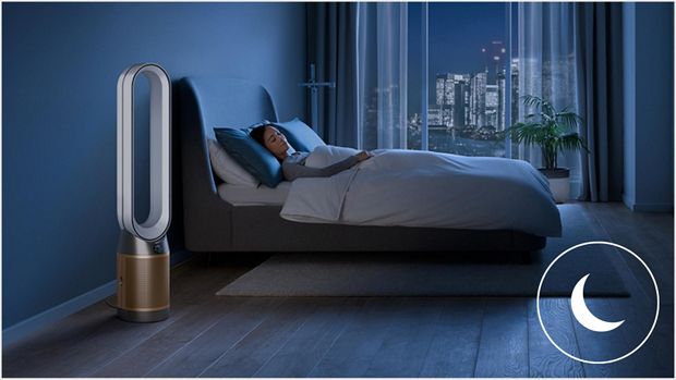 A Dyson machine in bedroom night time cooling off person sleeping in bed