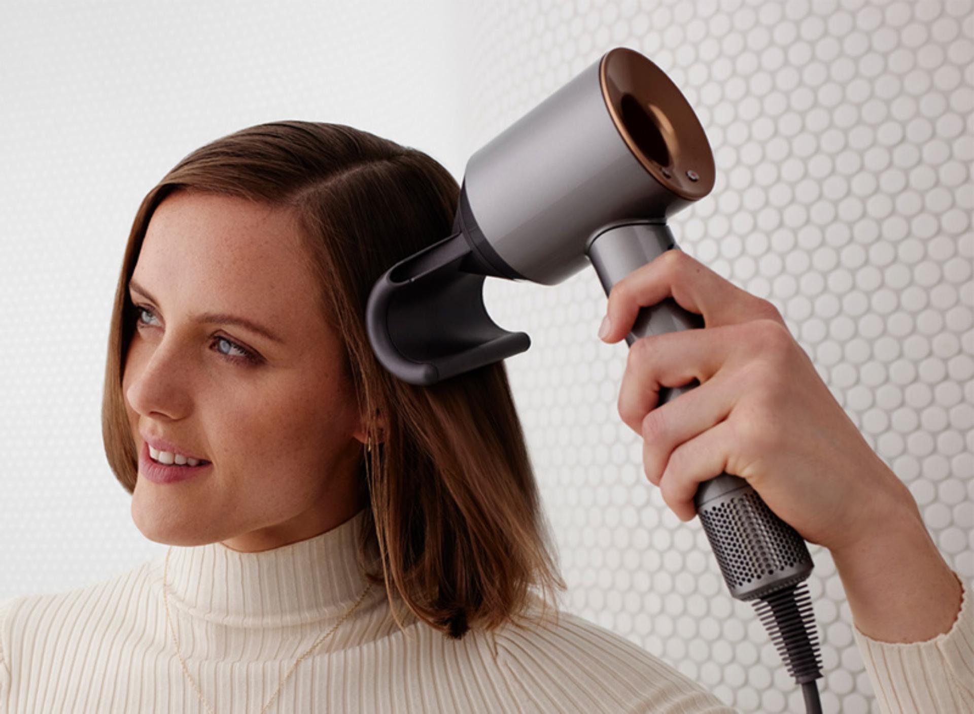 Model using the Dyson Supersonic hair dryer 