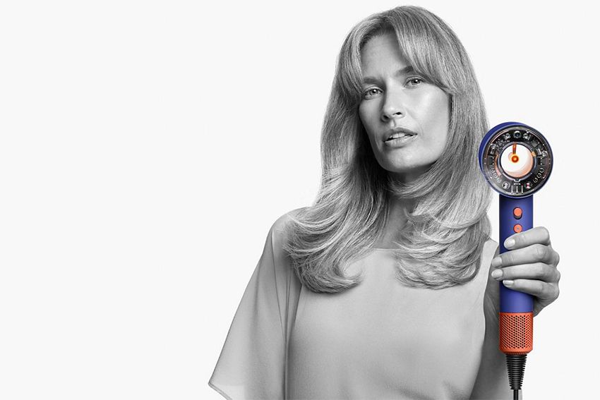 A model using a Dyson Supersonic r hair dryer