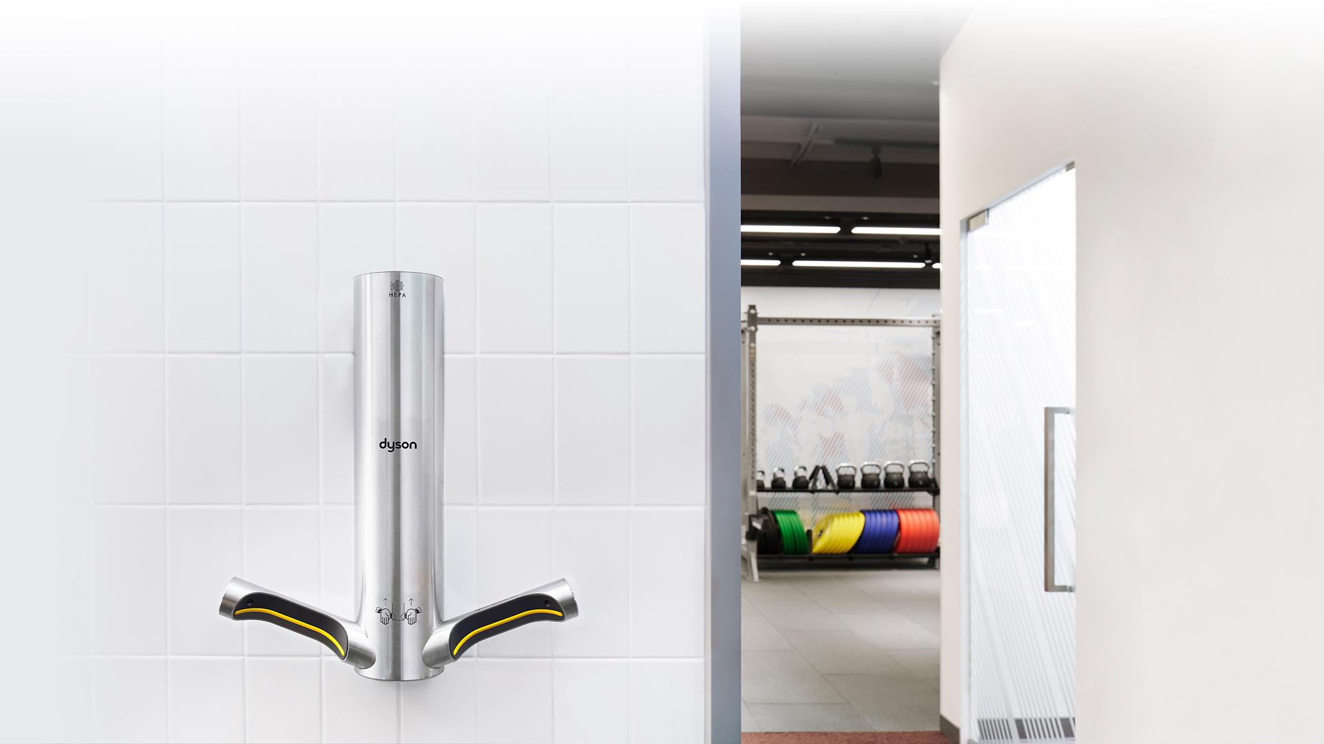 Dyson Airblade V and a row of Dyson Supersonic Professionals situated in The Well's bathroom