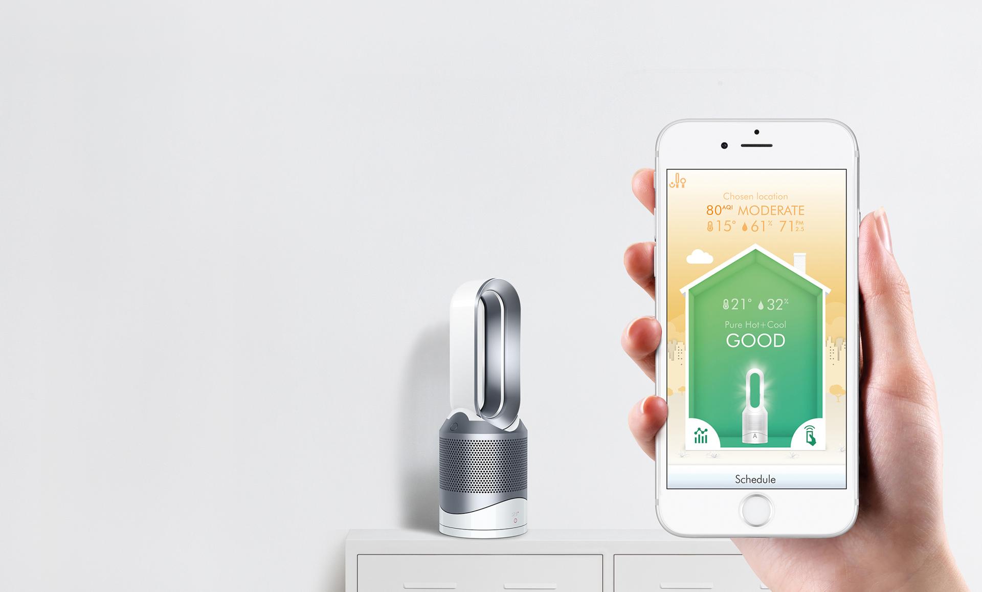 Dyson Pure Hot + Cool Link™ purifier heater next to smartphone app